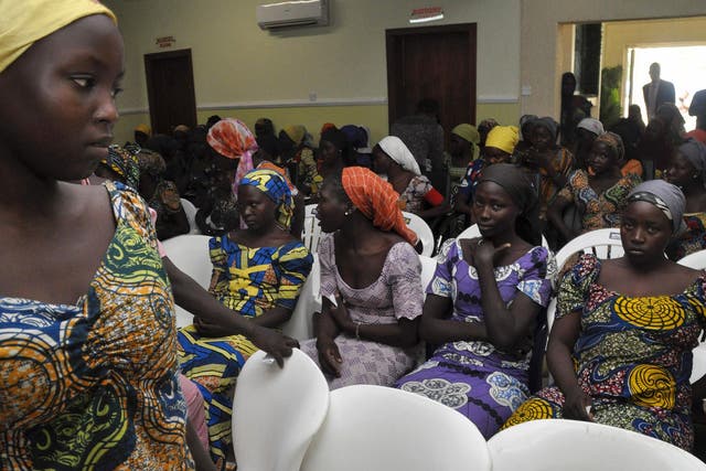 Some of the recently-freed girls wait in Abuja, the Nigerian capital