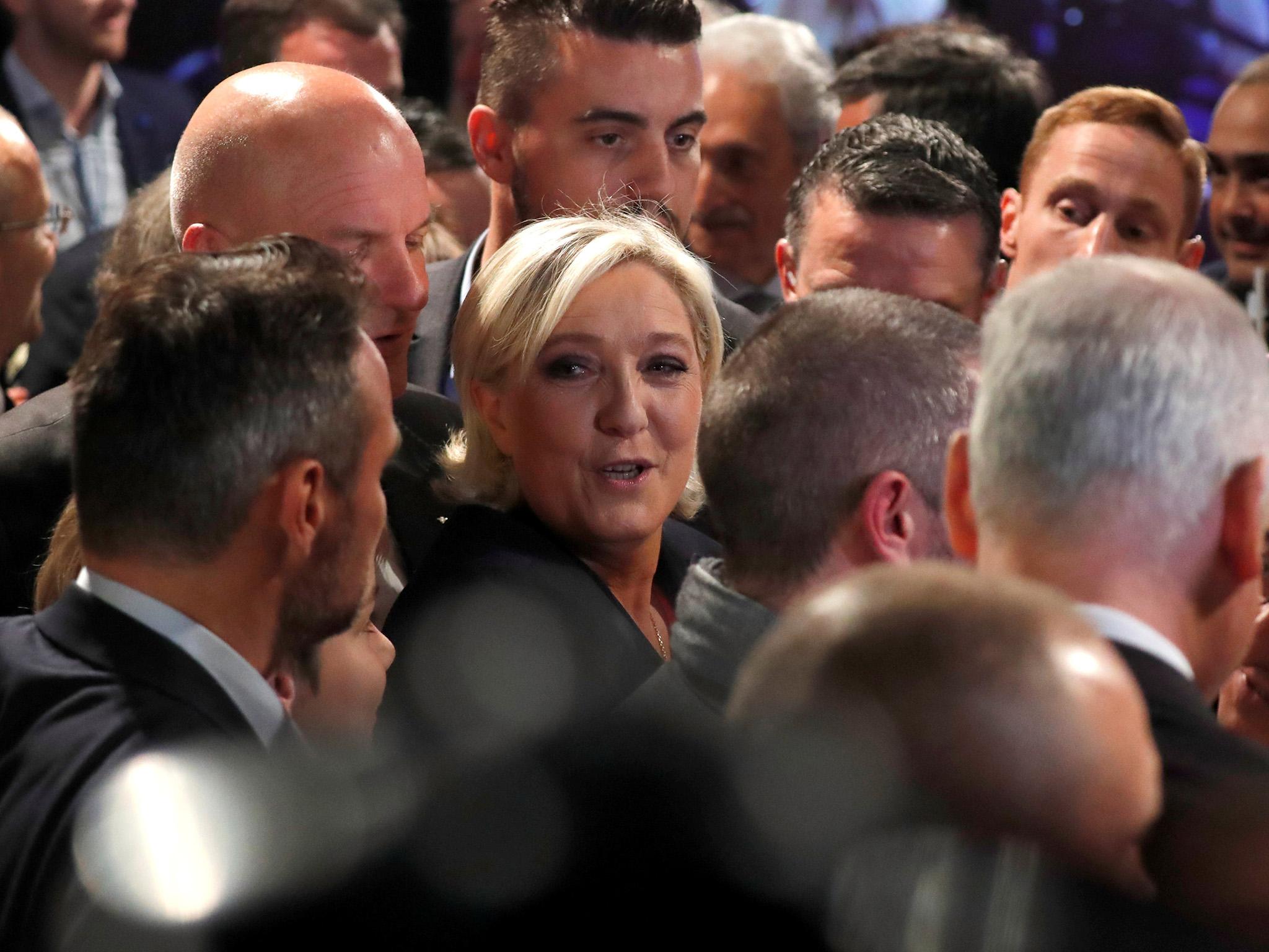 Marine Le Pen, French National Front (FN) political party candidate for French 2017 presidential election, greets supporters at the Chalet du Lac in the Bois de Vincennes in Paris after her defeat