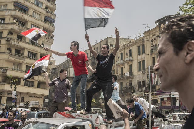 Egyptians supporters celebrate a premature victory for their presidential candidate Mohamed Morsi in Tahrir Square