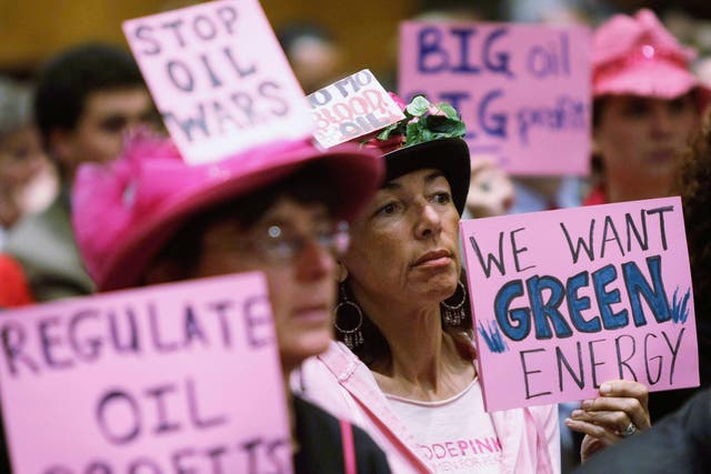 Code Pink members Desiree Farooz (C) and Toby Blome (L) protests during a hearing of the Senate Judiciary Committee in 2008