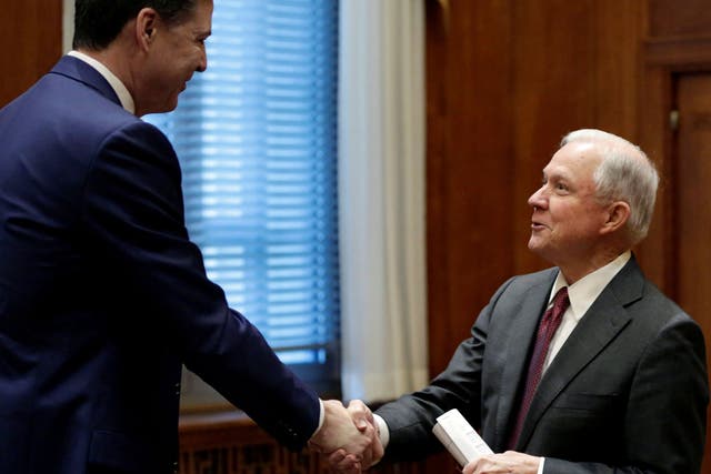Attorney General Jeff Sessions (R) shakes hands with former FBI Director James Comey