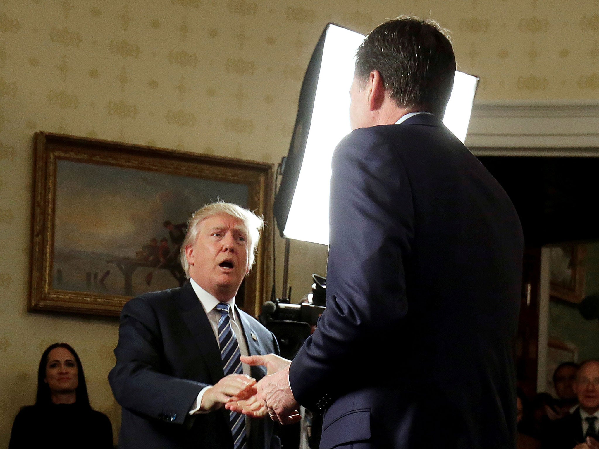 File: Trump greets the now former director of the FBI, James Comey, at the White House