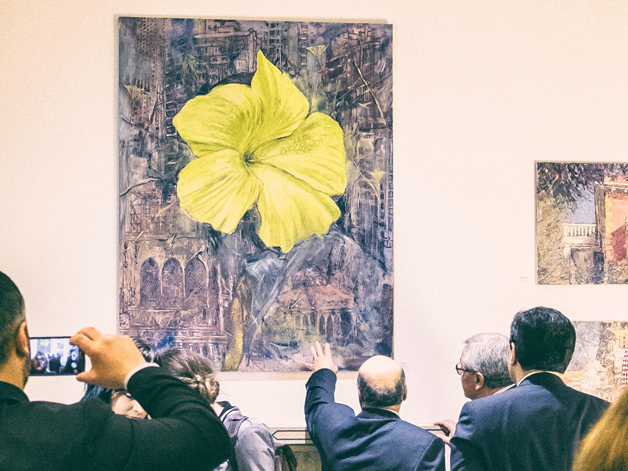 The image of a flower was painted over General Spears’ portrait by artist Tom Young, so that it could be included in the exhibition