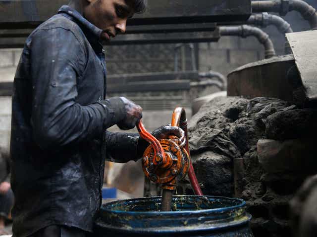 Khodor, 20, extracts fuel from plastic in a workshop in the rebel-held besieged Douma neighbourhood of Damascus