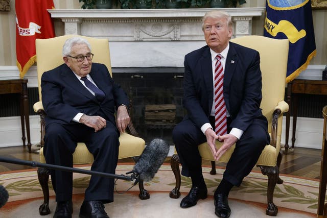 Donald Trump meeting with Henry Kissinger in the Oval Office