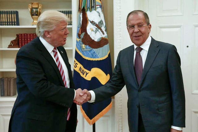 US President Donald Trump shakes hands with Russian Foreign Minister Sergey Lavrov in the White House
