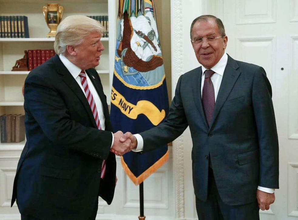 US President Donald Trump shakes hands with Russian Foreign Minister Sergey Lavrov in the White House