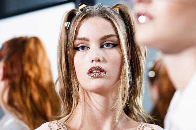 Makeup artist Peter Philips opted for glittering peach lips at Fendi