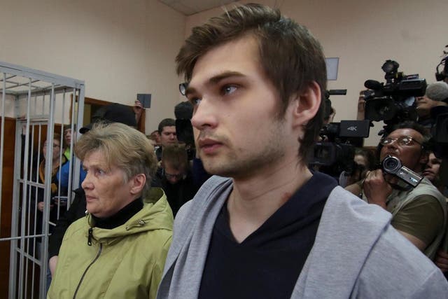 Ruslan Sokolovsky stands with his mother Yelena Chingina in court during his sentencing in Yekaterinburg, Russia