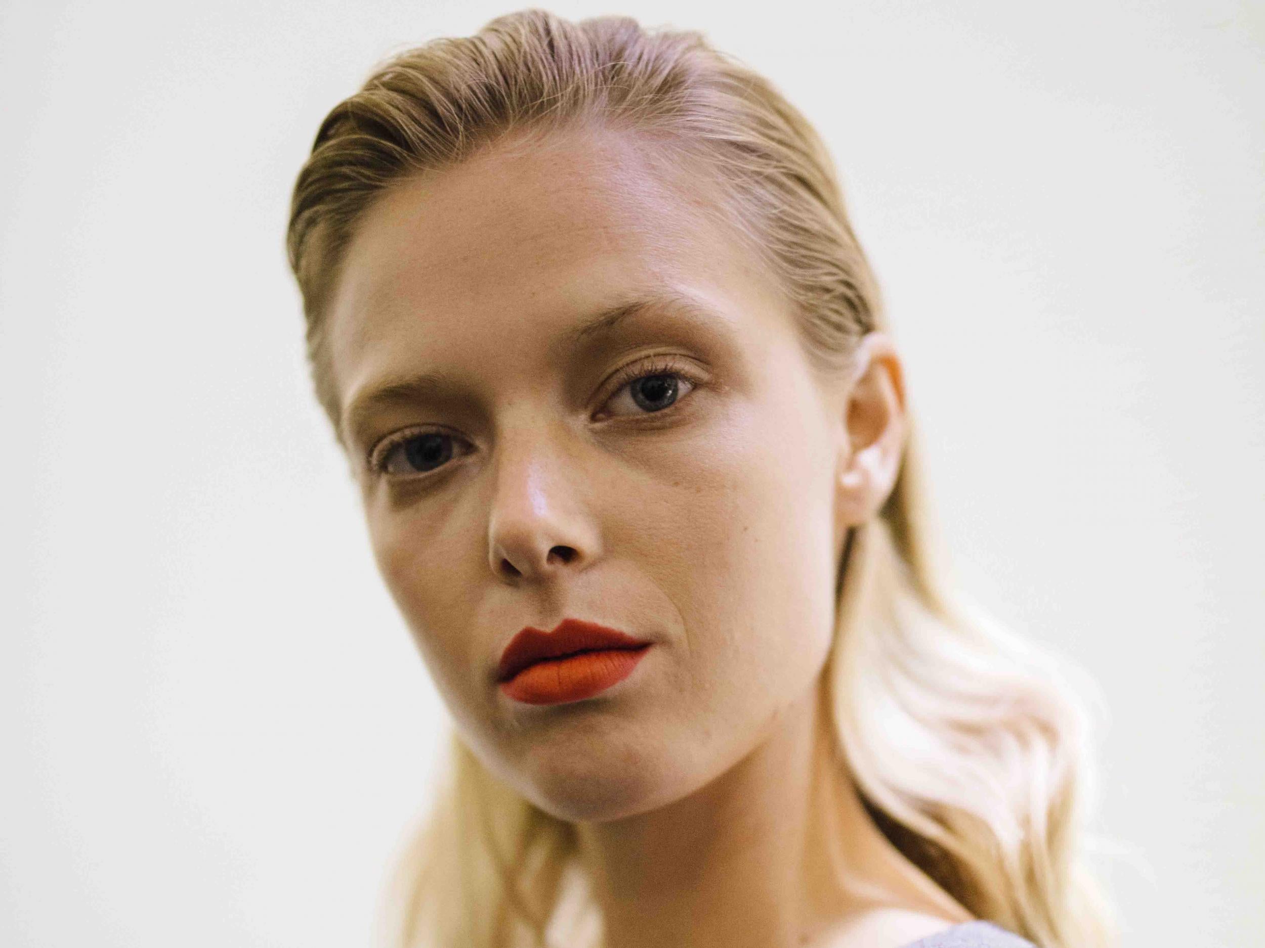 At Jason Wu, makeup artist Yadim paired a fresh, bare face with a bright orange-red lips