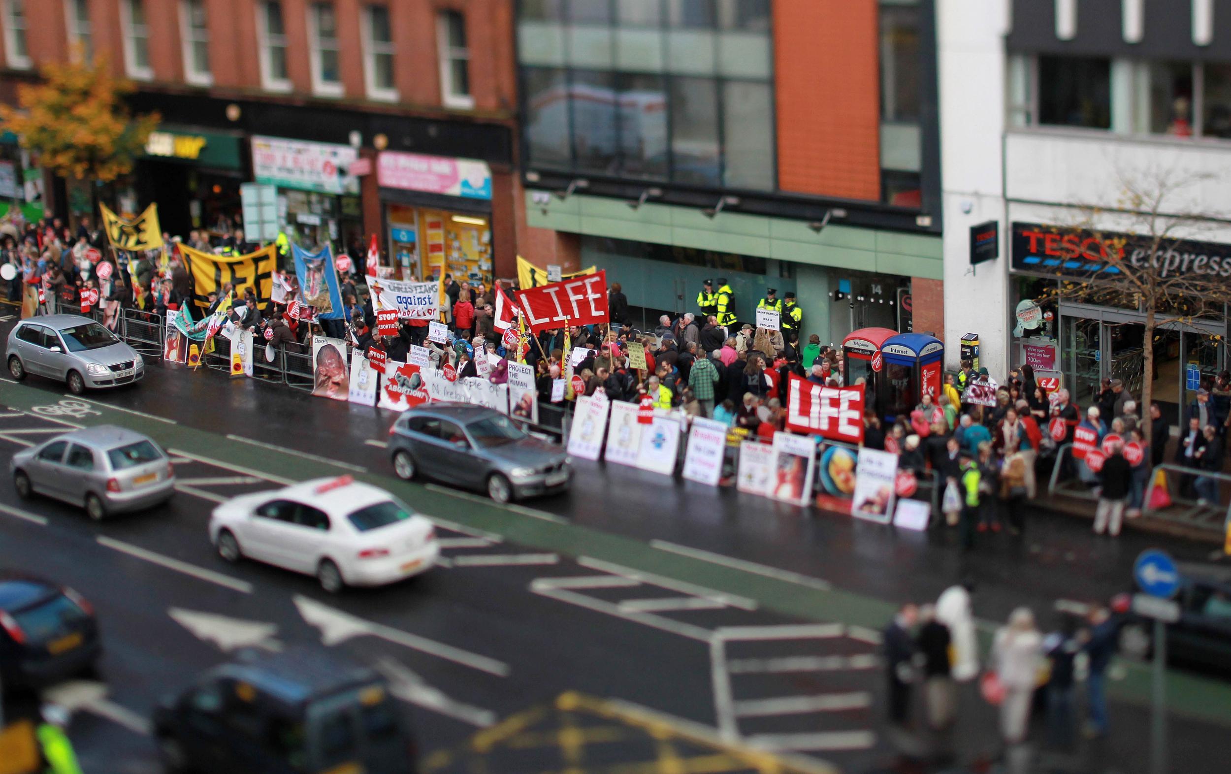 Anti-abortion protesters harass women outside an abortion clinic in Northern Ireland