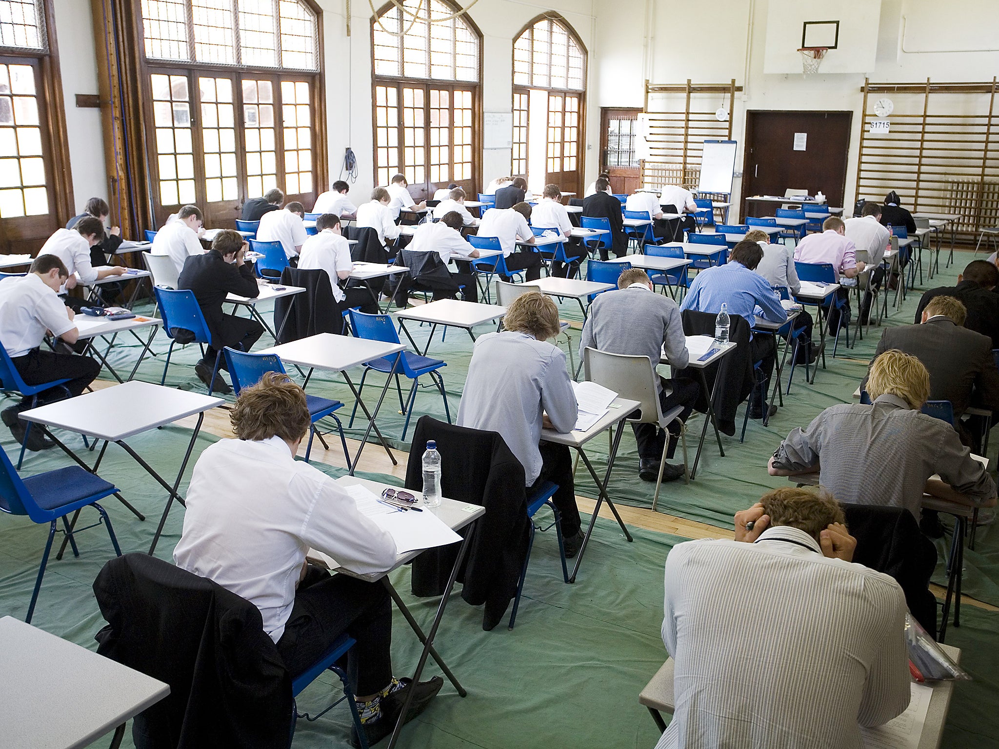 Students sitting exams in secondary school