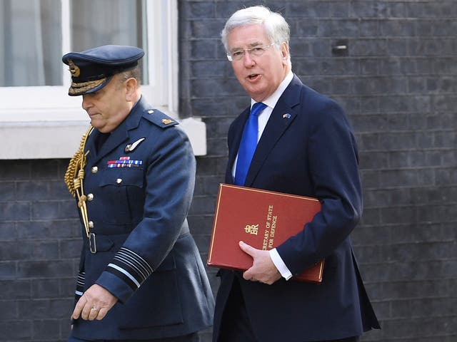 Chief of the Defence Staff Air Chief Marshal Sir Stuart Peach and Defence Secretary Sir Michael Fallon arriving at 10 Downing Street