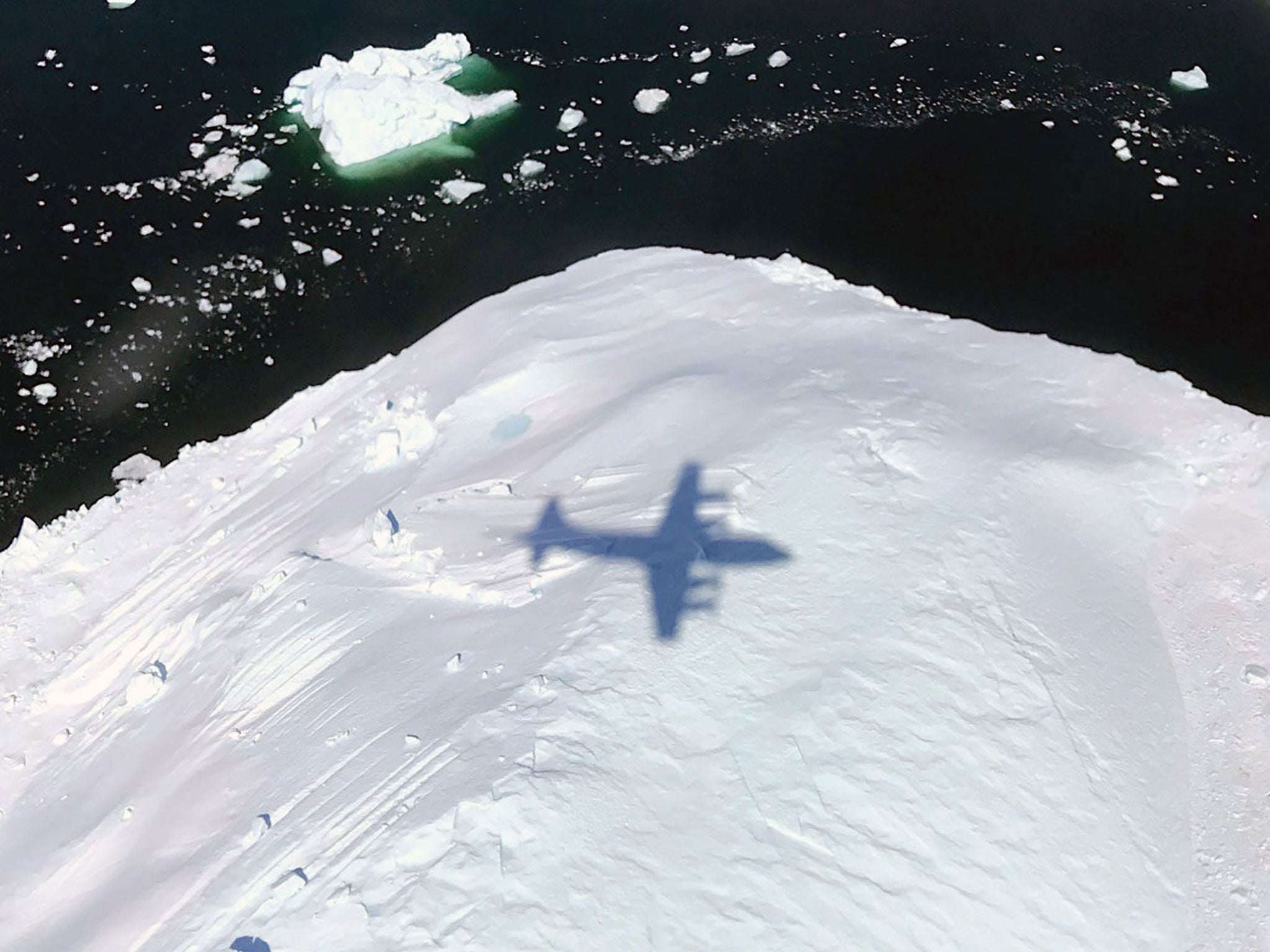 Shadow of a Nasa aircraft on Operation IceBridge, collecting data from changing polar land and sea ice in the Arctic