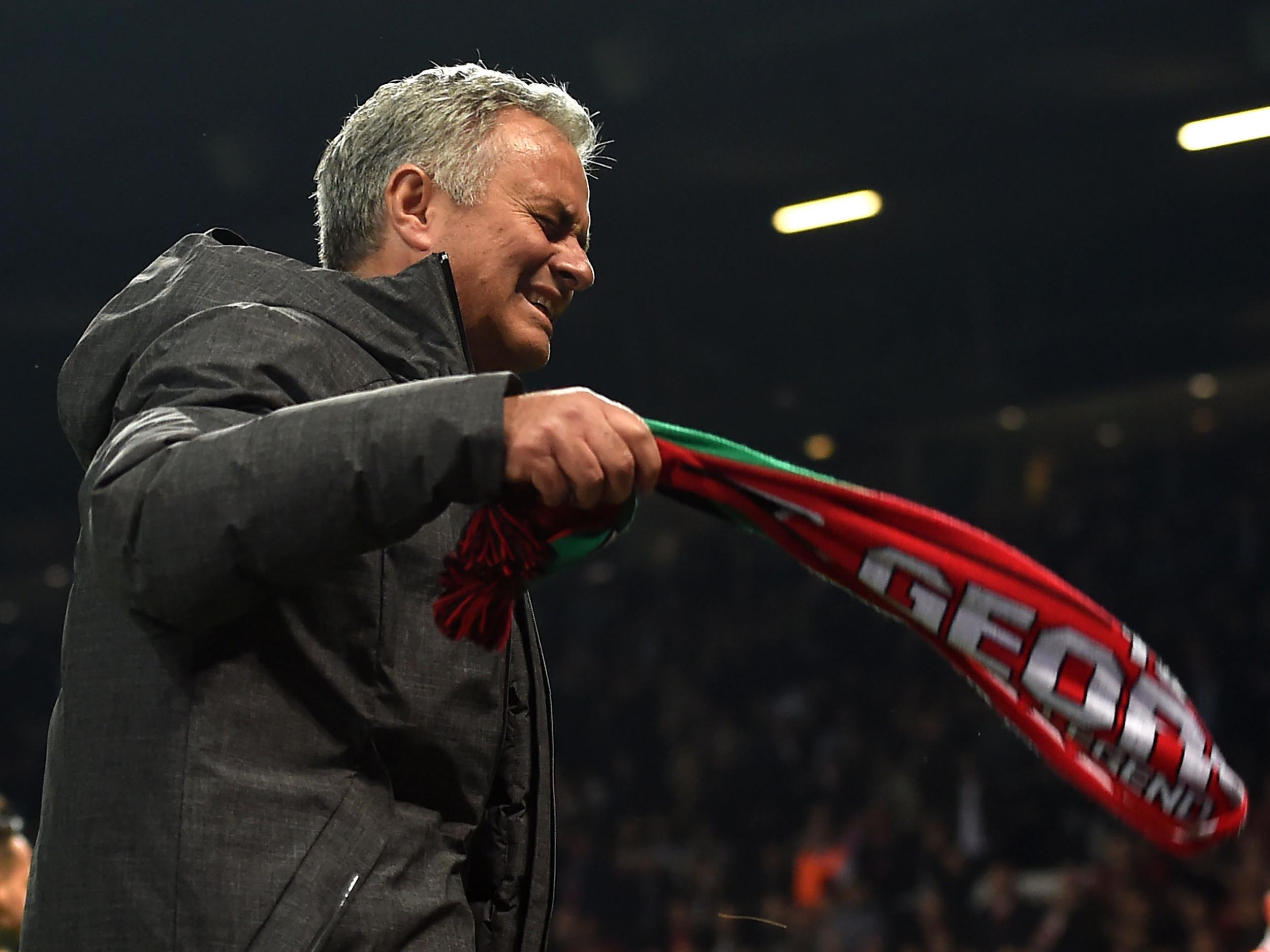 Mourinho swang a scarf around in jubilation at the end of the game