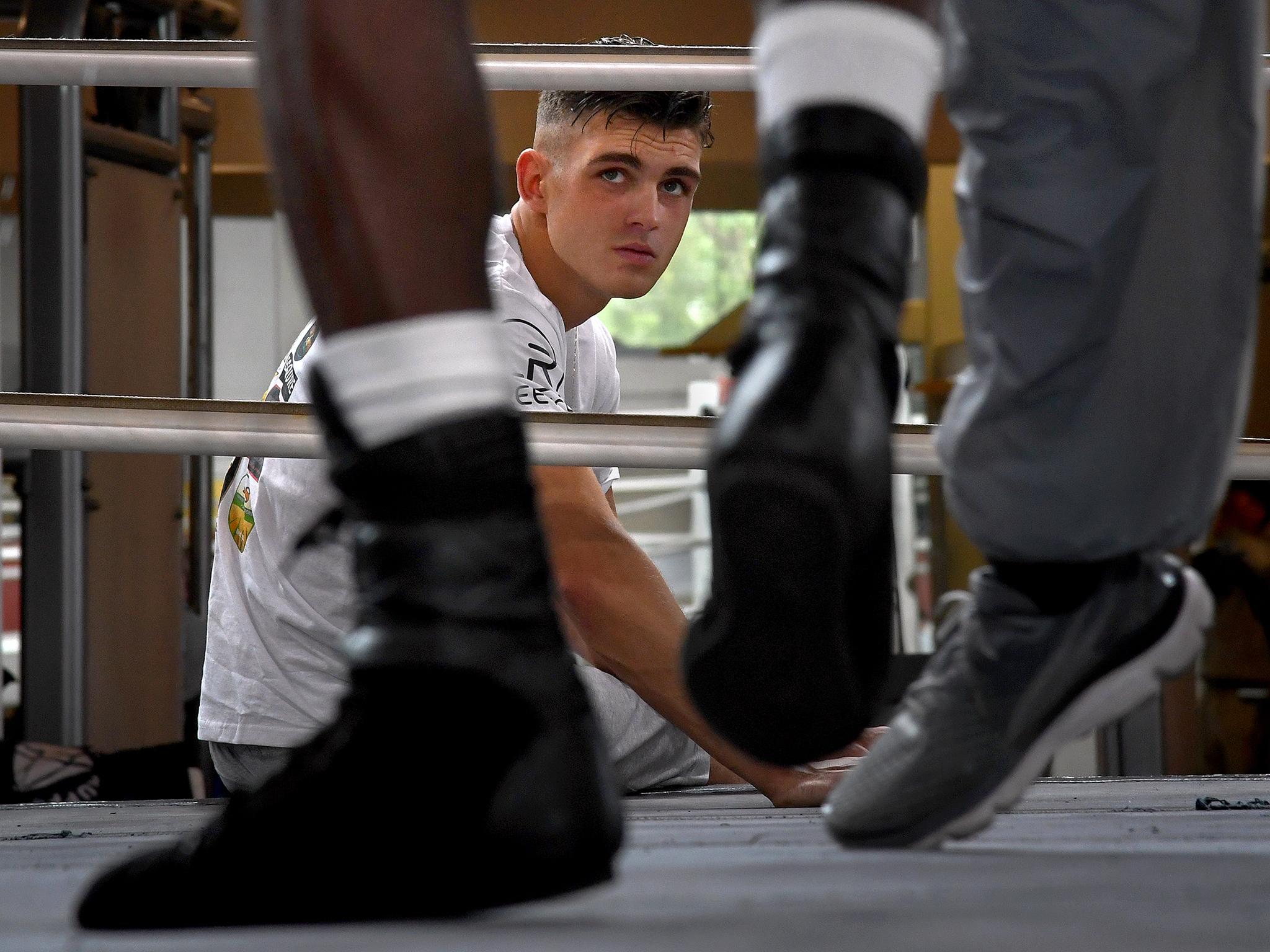 Irish boxer Lee Reeves watches local professional boxers spar at the Bald Eagle Recreation Center in Southwest Washington