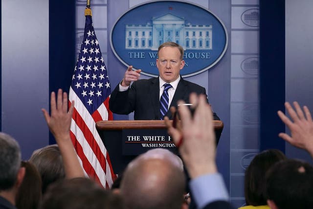 White House Press Secretary Sean Spicer calls on reporters during the daily news conference in the Brady Press Briefing Room at the White House April 10, 2017