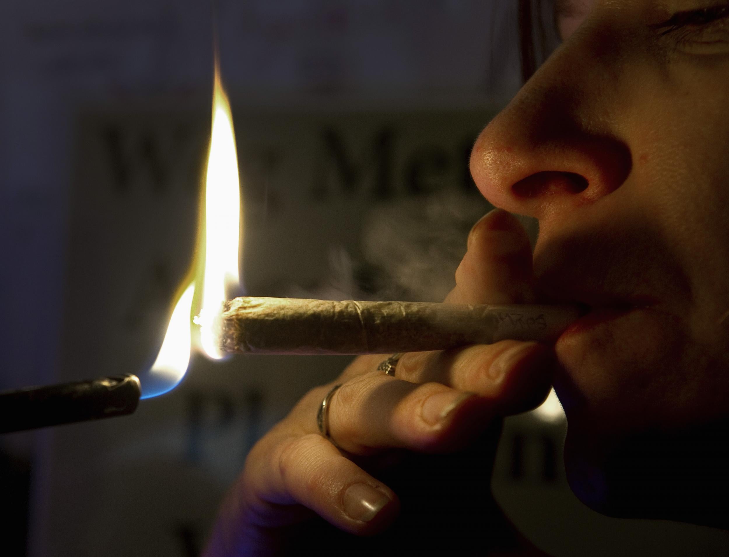 A file photo of a man smoking a joint