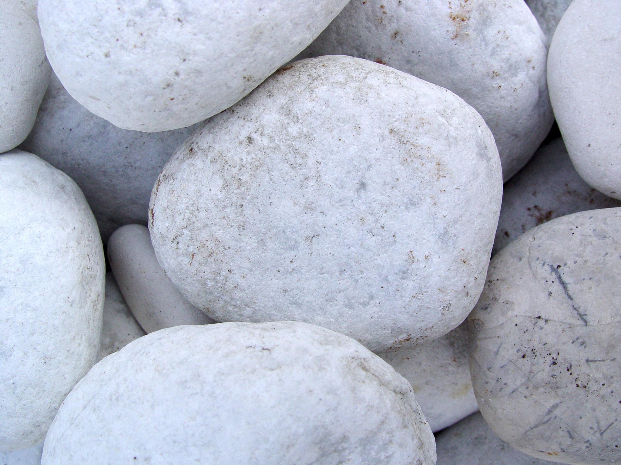 Homeowners and tenants are being warned over suspicious white pebbles