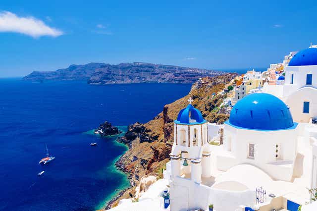 Iconic: Santorini’s white buildings, windmills and blue domes have distinguished it internationally