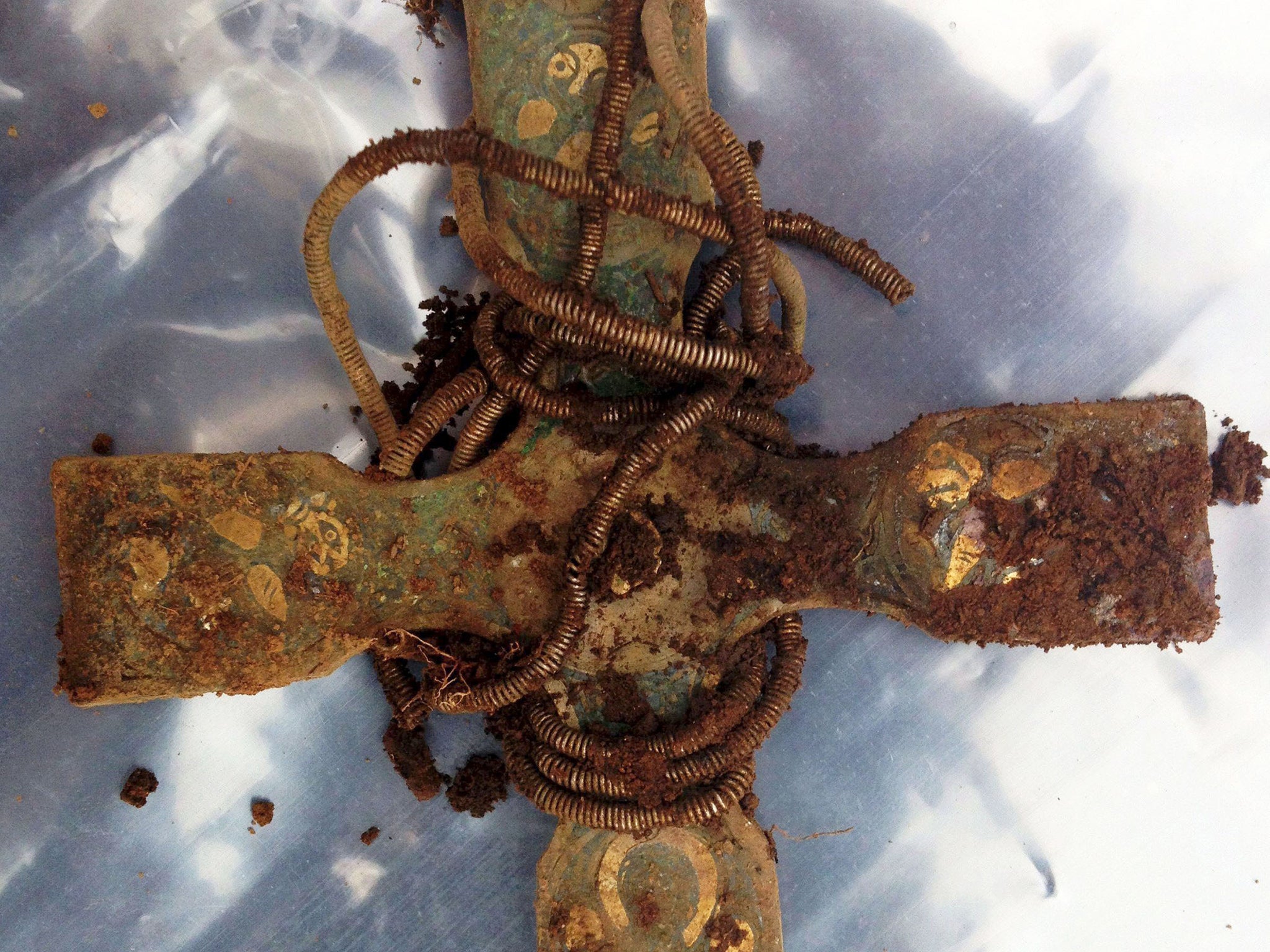 An early medieval cross, part of a hoard of Viking treasure which has been unearthed