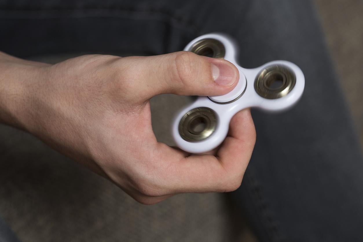 The gadget has three prongs centred around a circle with bearings in the middle and is spun to whir hypnotically