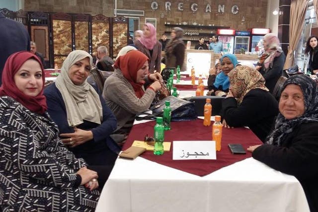 Palestinian women order a mixture of salt and water in solidarity with striking prisoners in Israeli jails