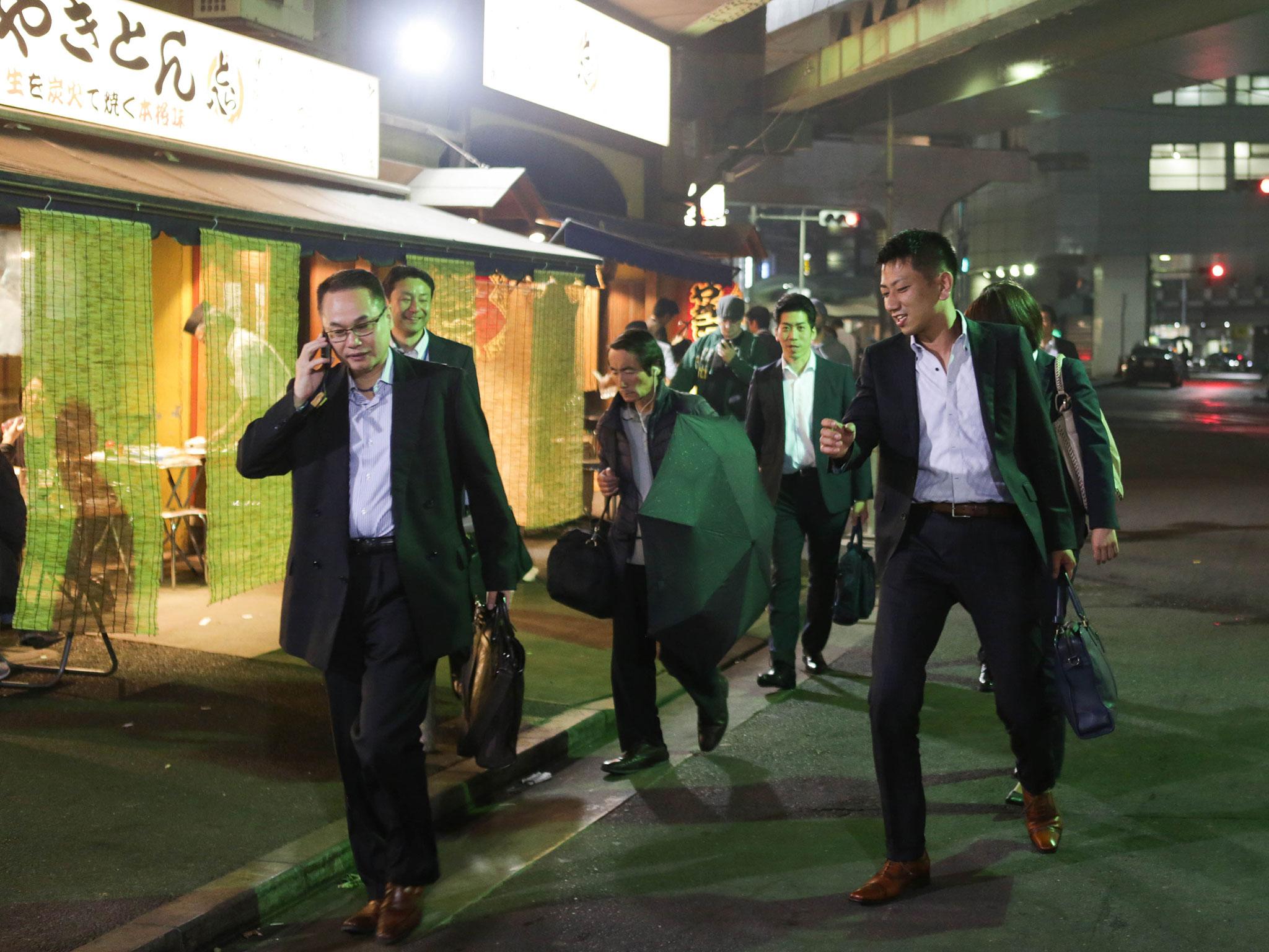 Salary men enjoy drinking and walking on bar street after five in Tokyo