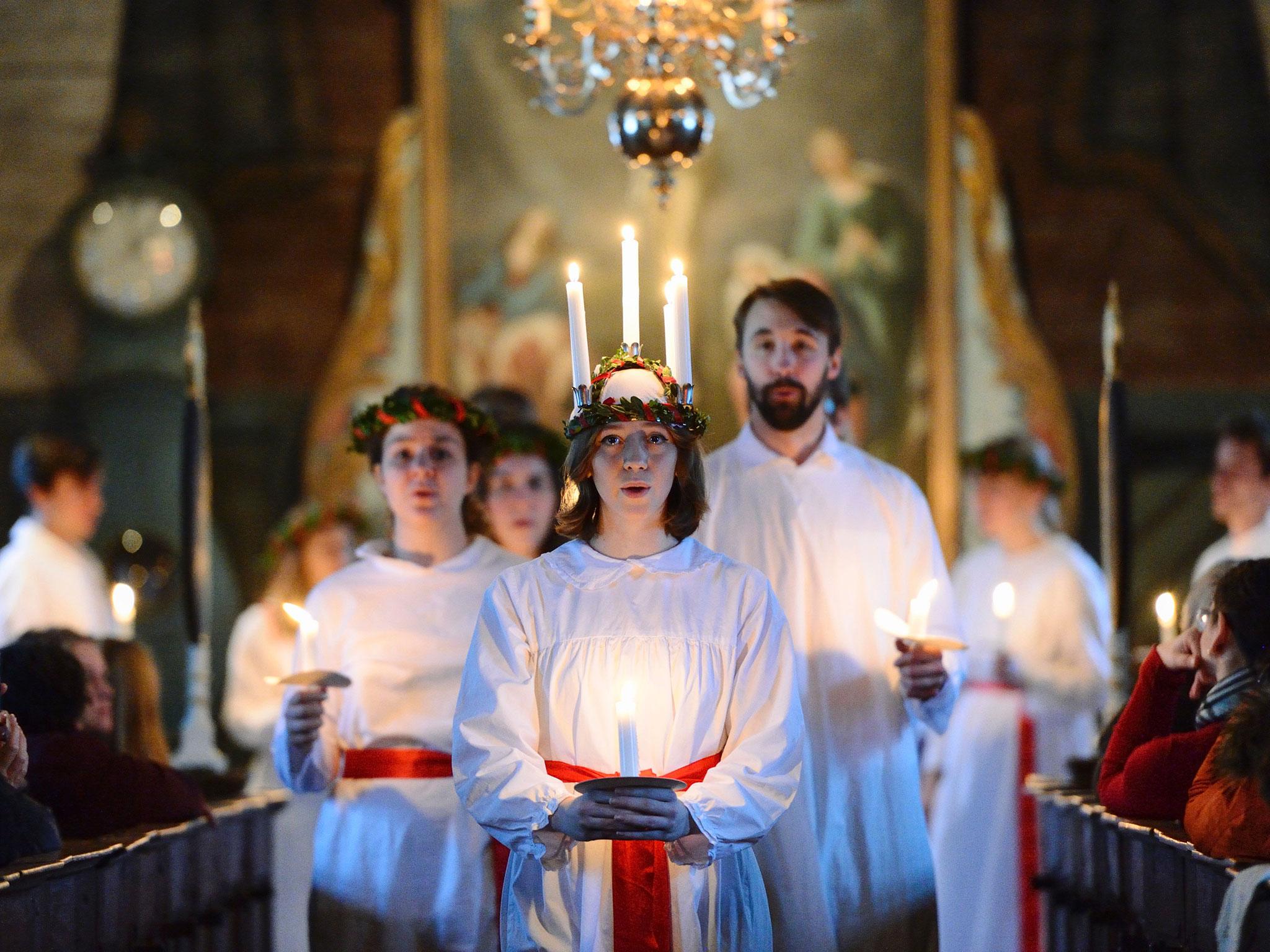 The 'Kongl. Teknologkoren' choir performs in Seglora church at the open-air museum Skansen in Stockholm/