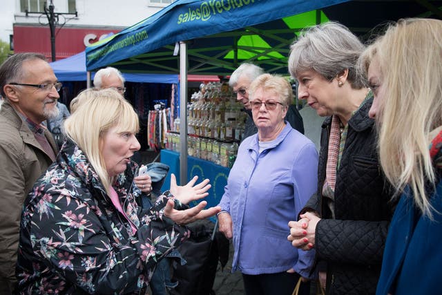 Prime Minister Theresa May meets Cathy Mohan at Abingdon market in Oxfordshire