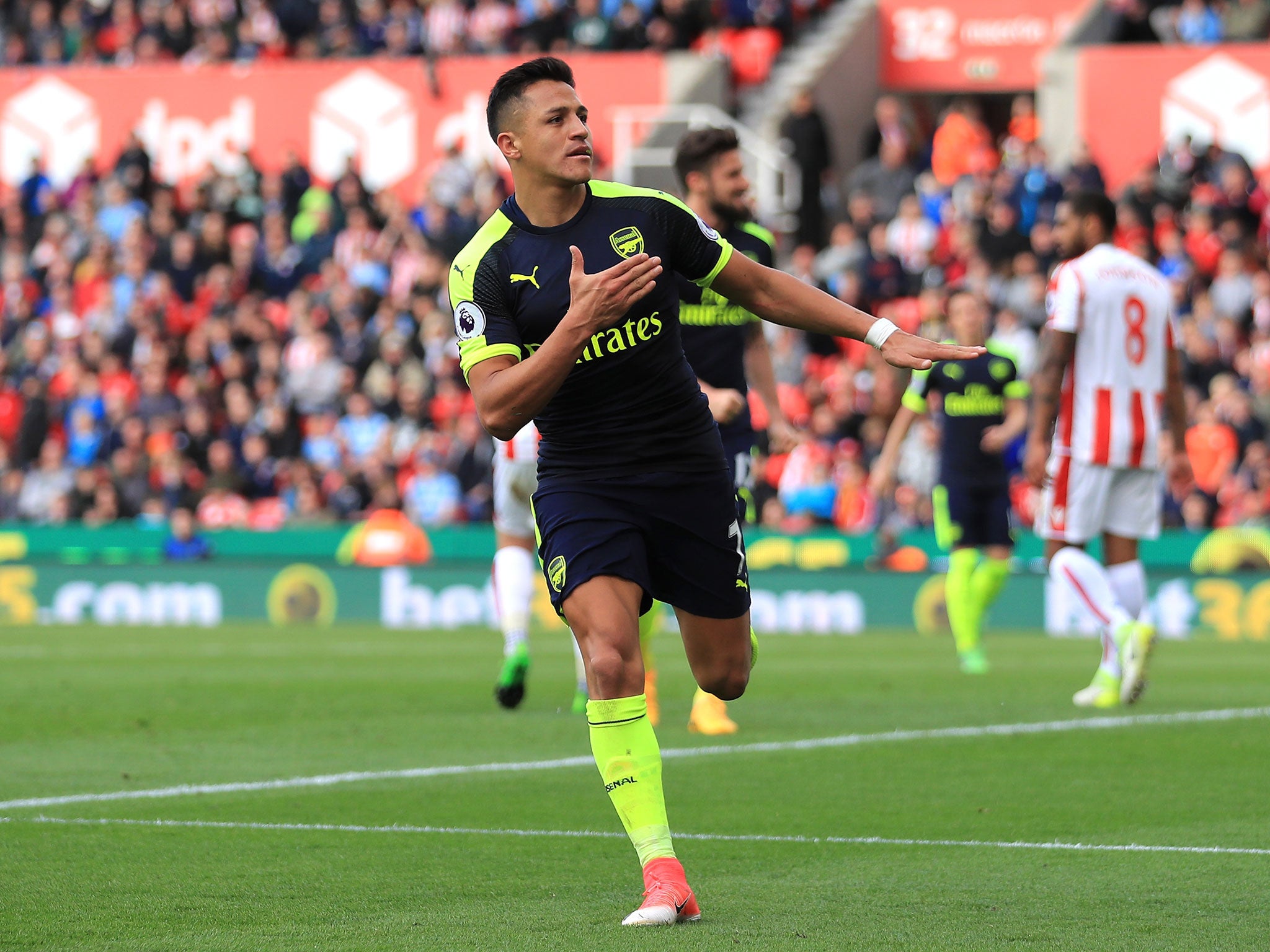Alexis Sanchez celebrates scoring against Stoke at the weekend