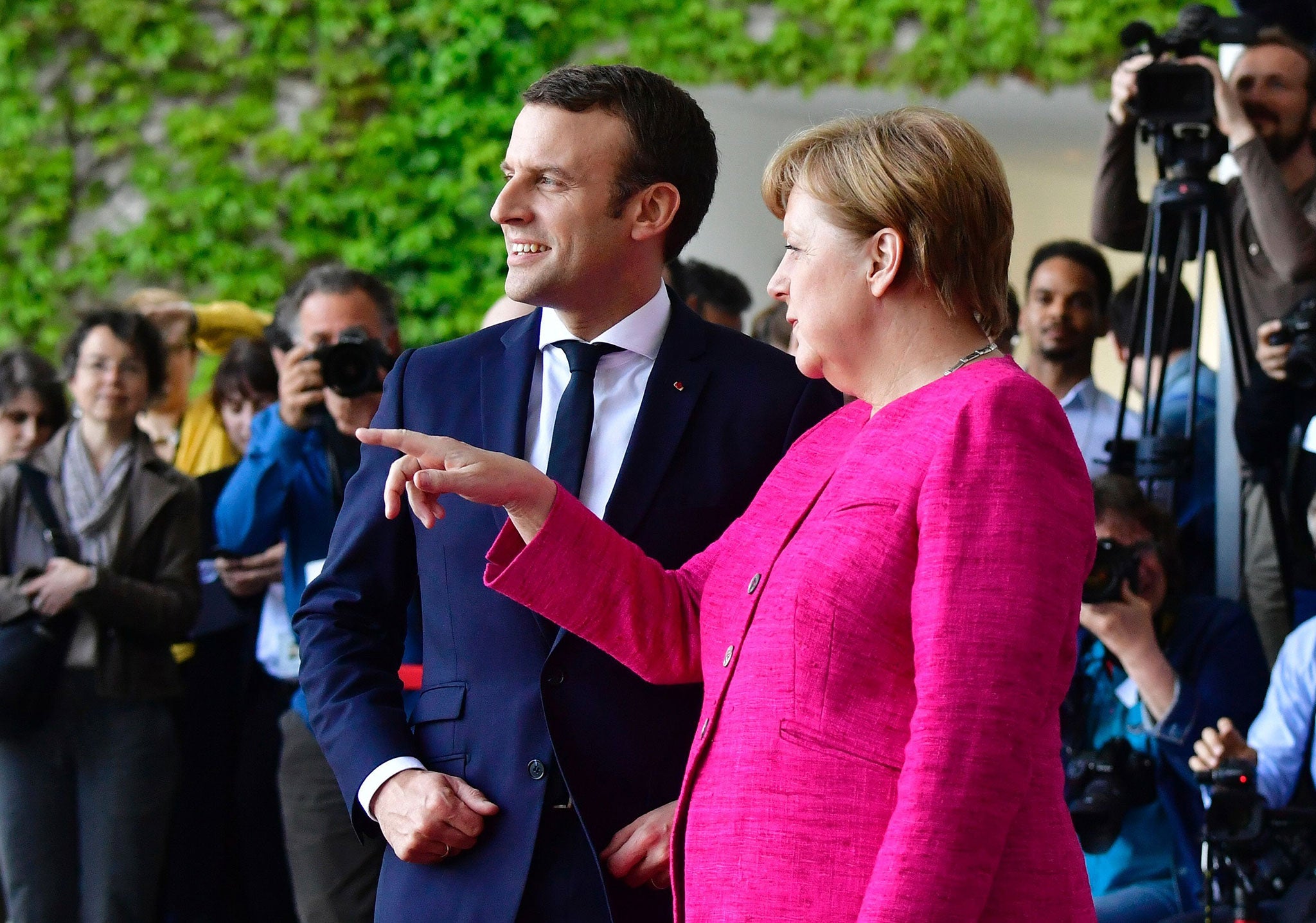 German Chancellor Angela Merkel welcomes Emmanuel Macron for talks on strengthening the EU, one day after the new French President took office (AFP/Getty)