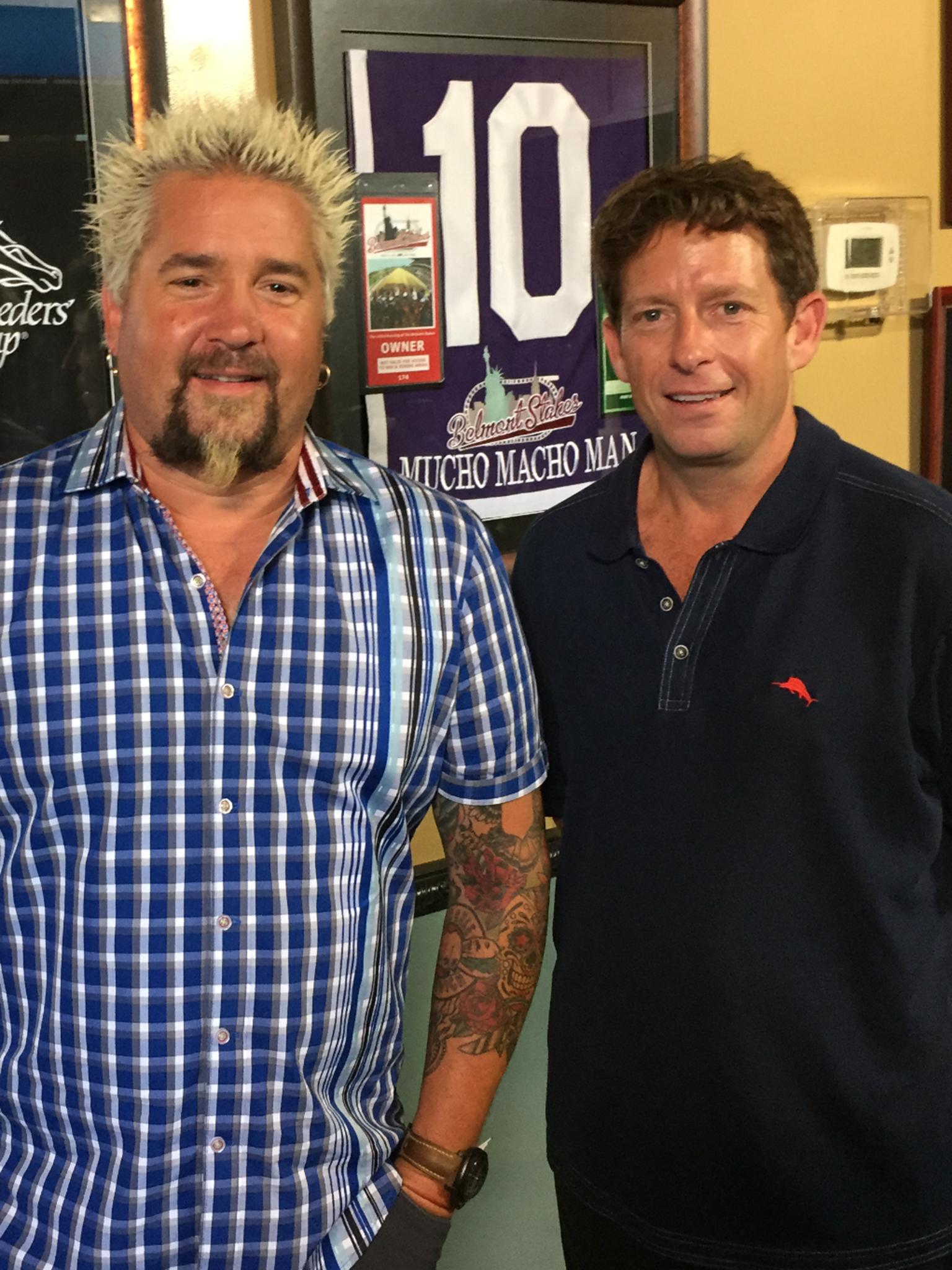 Chad Cooley, the owner of Momma's Mustard Pickles &amp; BBQ, with Guy Fieri (left)