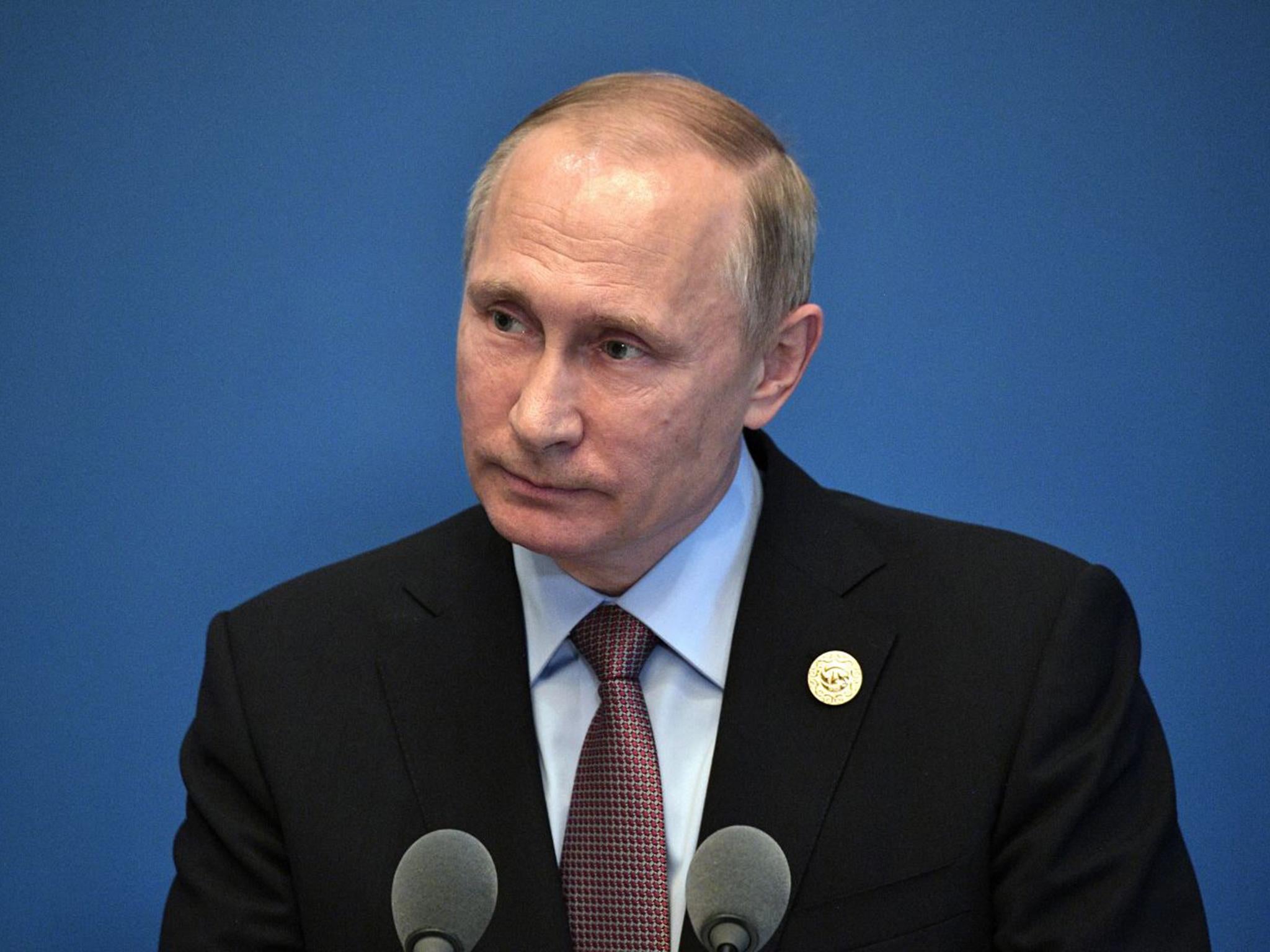 Russian President Vladimir Putin speaking to the media at the China National Convention Center