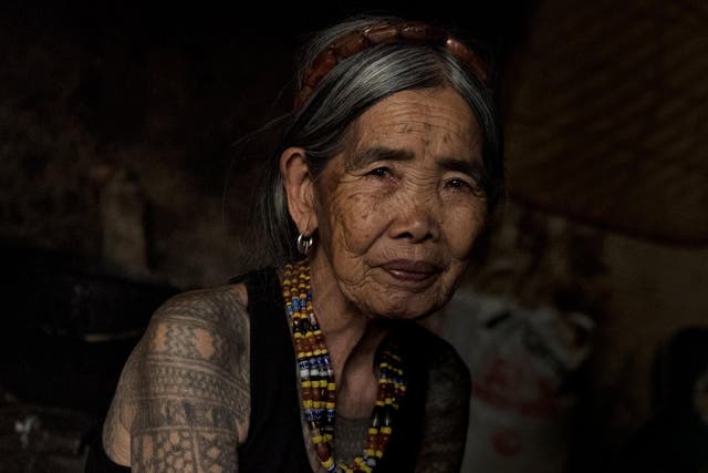 Maria Fang-od Oggay at her home in the village of Buscalan, in the northern Philippines, last week. She belongs to the last generation of her ethnic group bearing a full set of traditional tattoos and is one of the few who remember how they are done