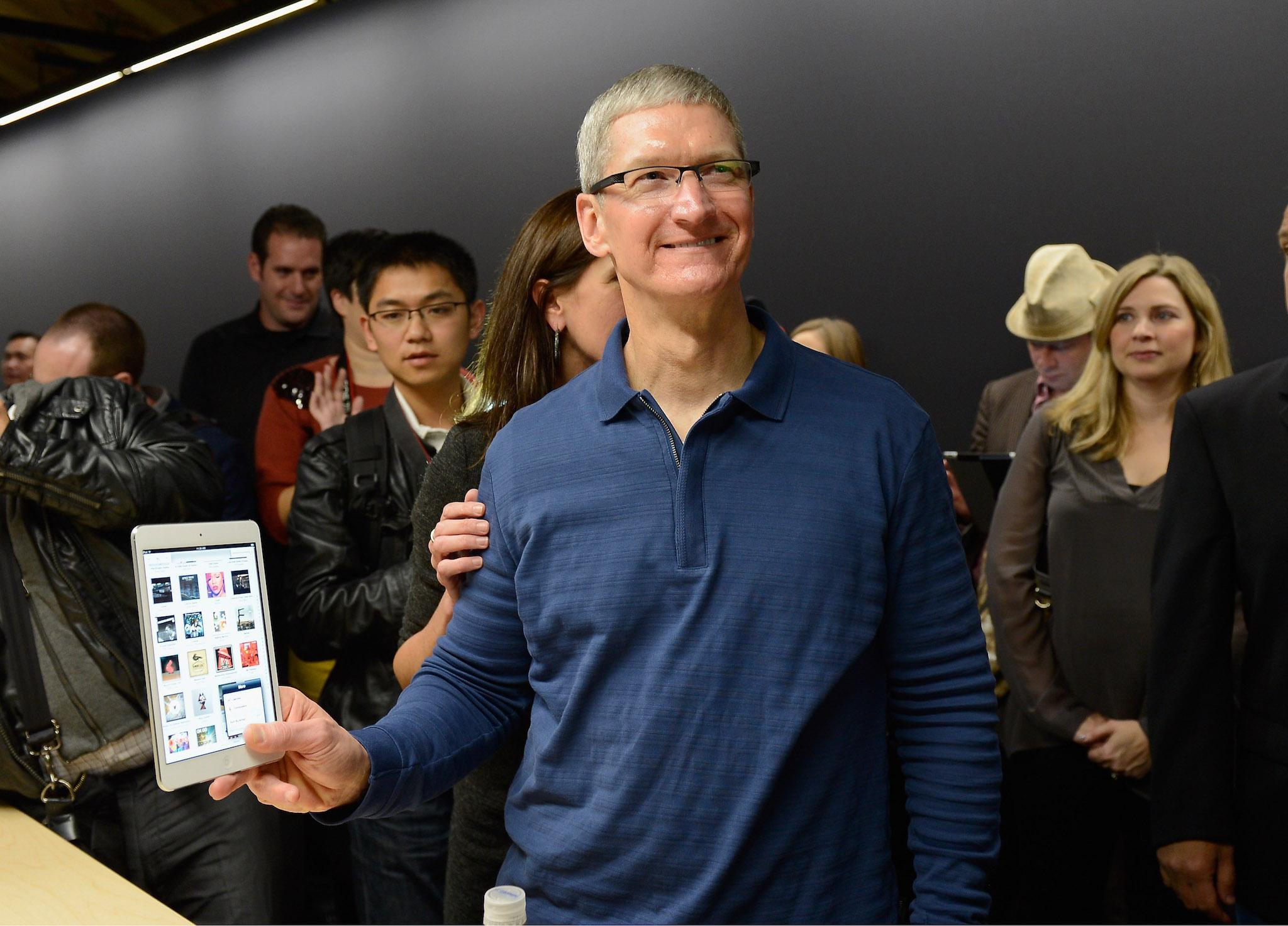 Apple CEO Tim Cook speaks displays the new iPad mini after it was unveiled