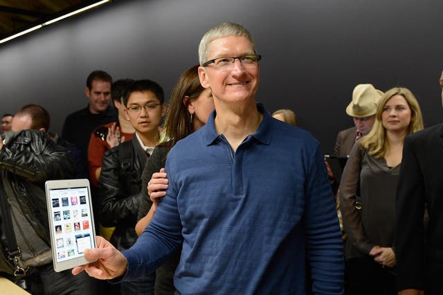 Apple CEO Tim Cook speaks displays the new iPad mini after it was unveiled