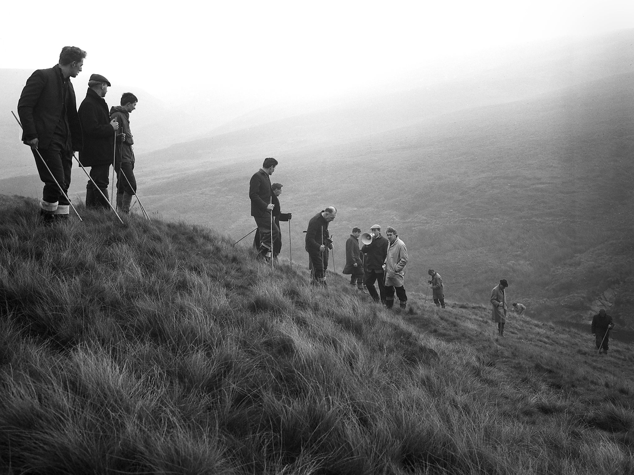 Police search Saddleworth Moor for the bodies of the victims of the Moors Murderers