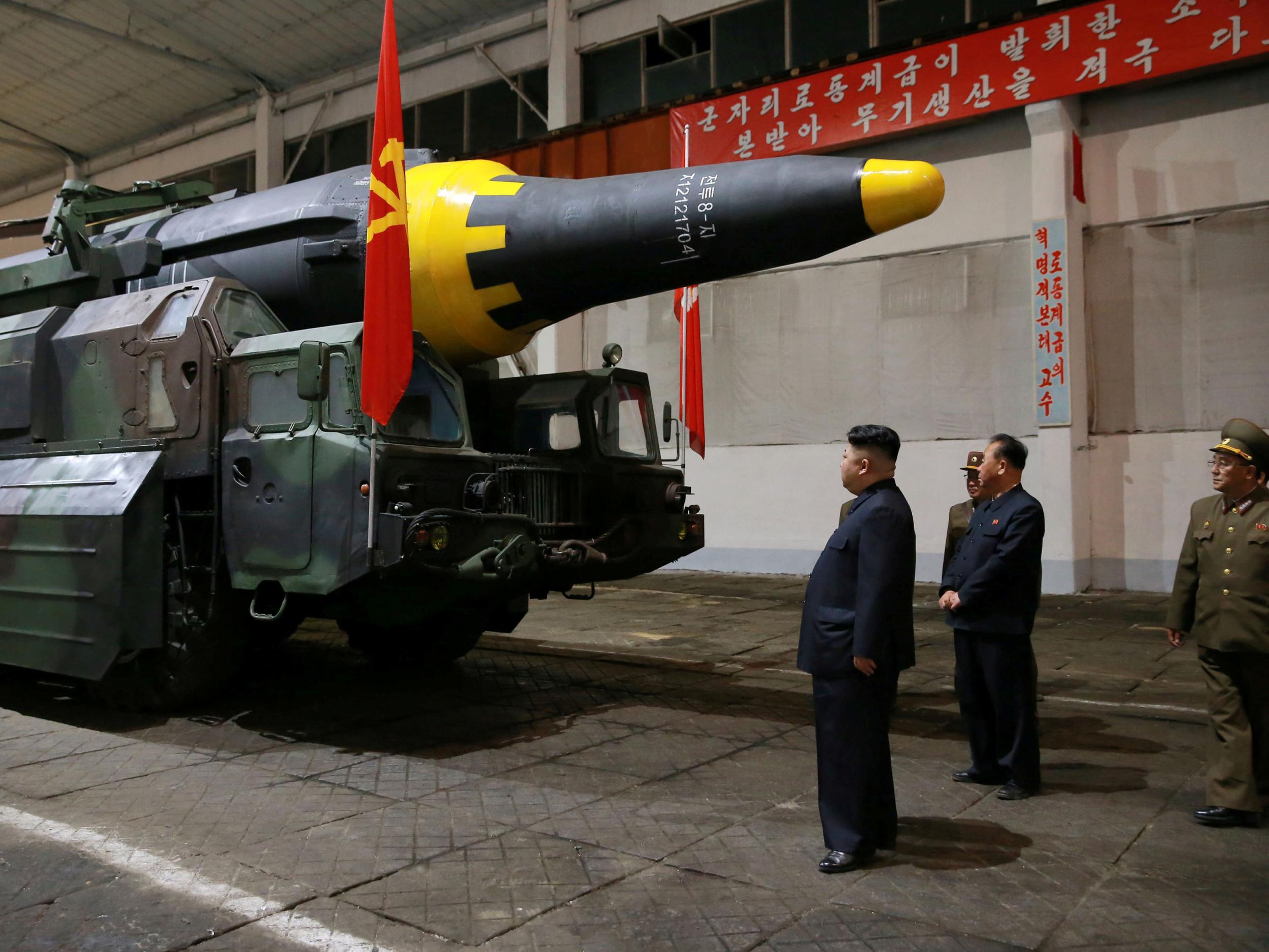 North Korean leader Kim Jong-un inspects the long-range strategic ballistic rocket Hwasong-12