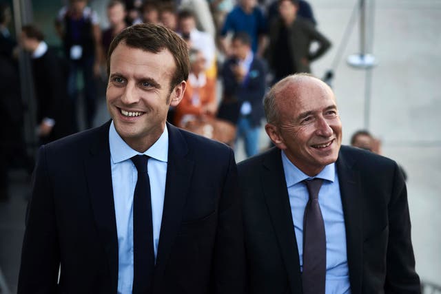 File image of Emmanuel Macron (L), with the mayor of Lyon Gerard Collomb, who he has appointed as French interior minister