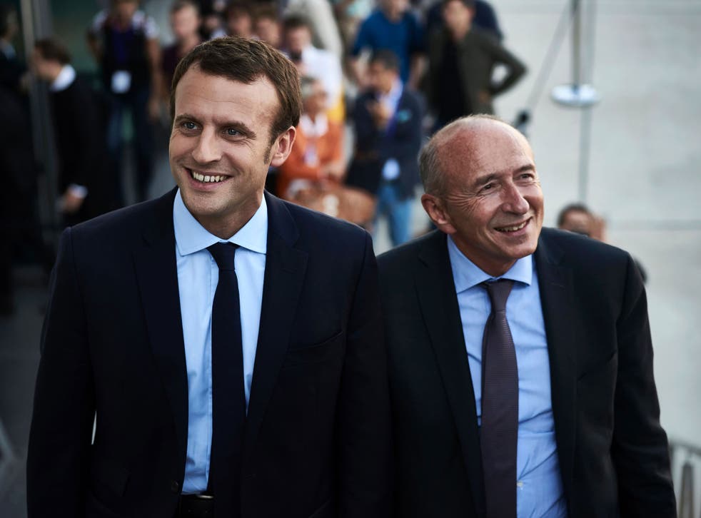 File image of Emmanuel Macron (L), with the mayor of Lyon Gerard Collomb, who he has appointed as French interior minister