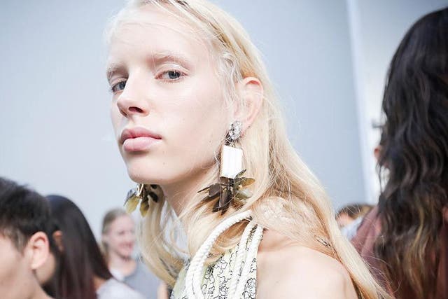 The models were given a high-shine finish with dewy skin at Marni