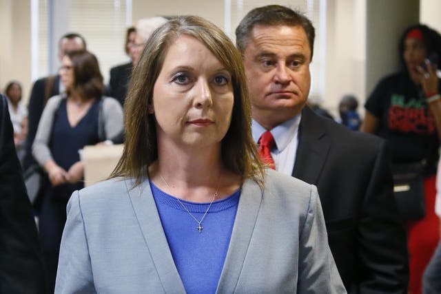 Betty Shelby leaves the courtroom