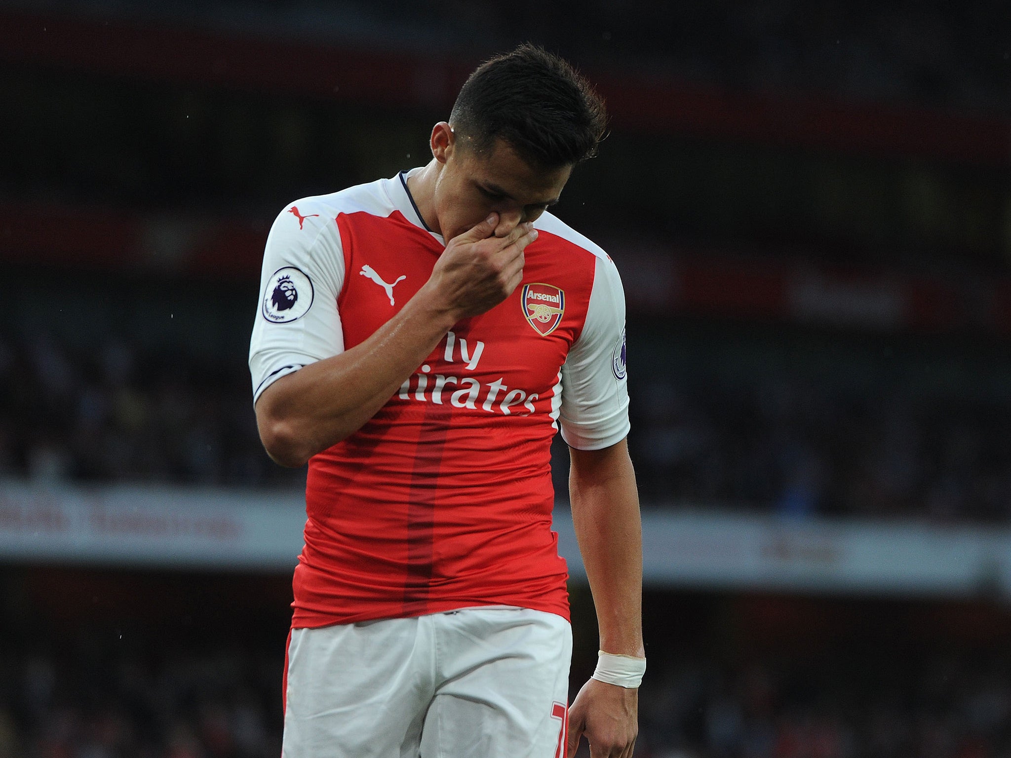 Alexis Sanchez has mounted a defence of his beleaguered manager Arsene Wenger