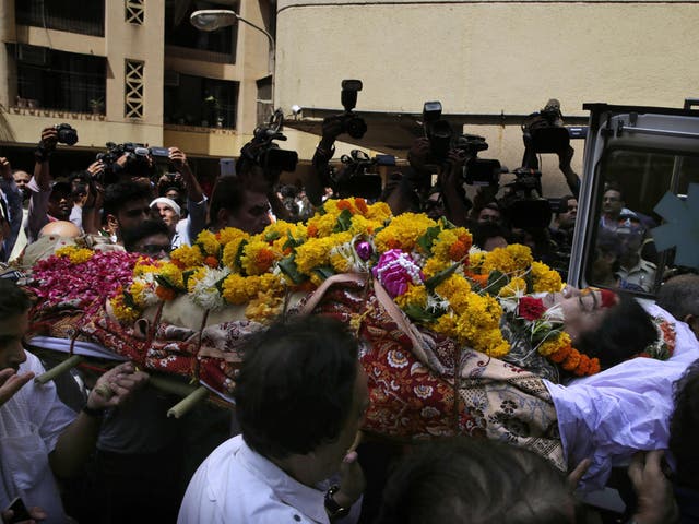 Friends and relatives carry the body of Bollywood actress Reema Lagoo during her funeral in Mumbai on 18 May 2017