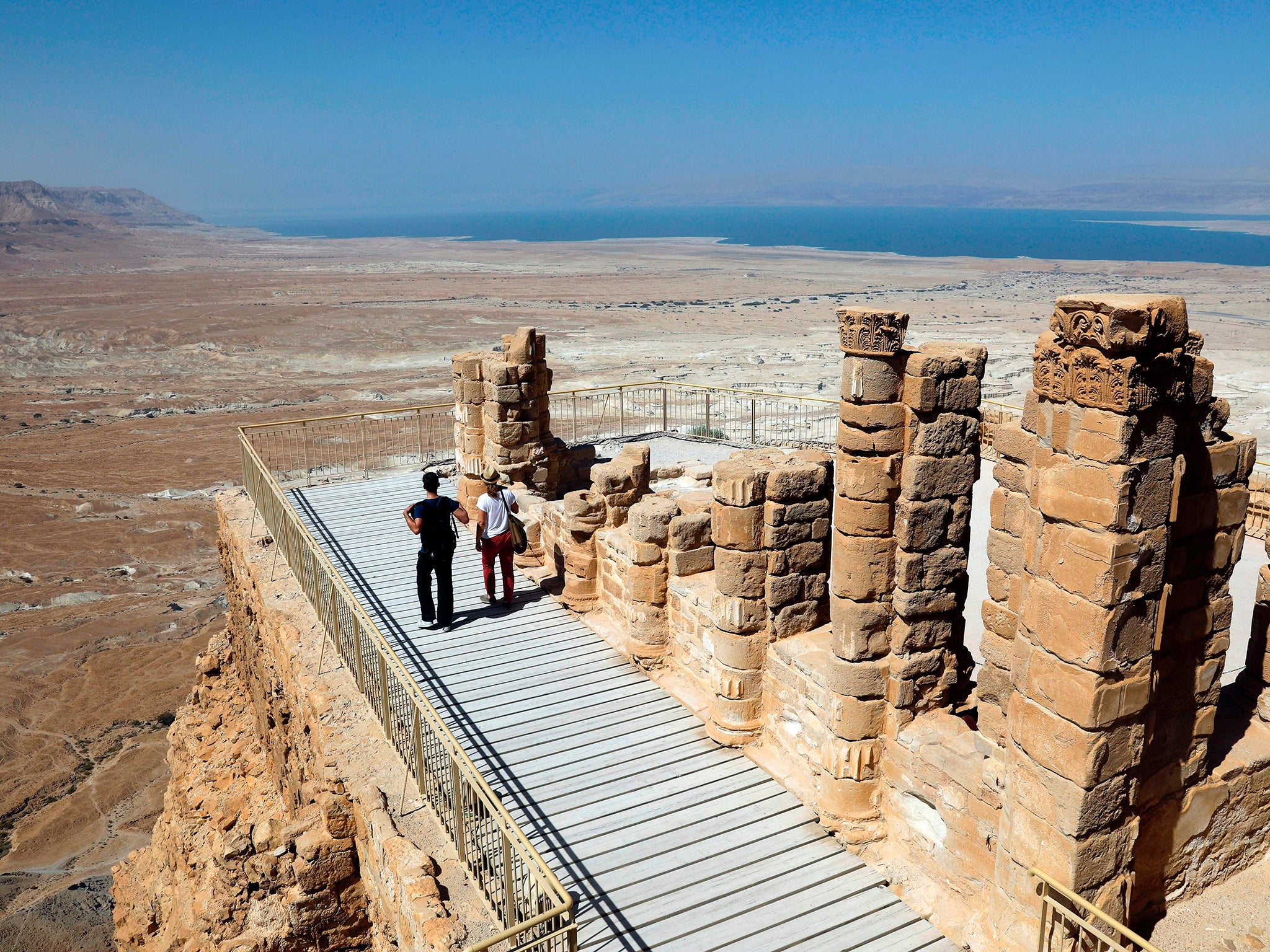 President George W. Bush and President Bill Clinton took a cable car to visit the ancient hilltop fortress of Masada in the Judean desert