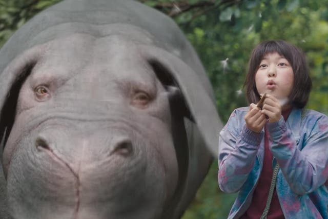 Mija (Ahn Seo-hyun) with her genetically modified pig-like animal, the title character in ‘Okja’