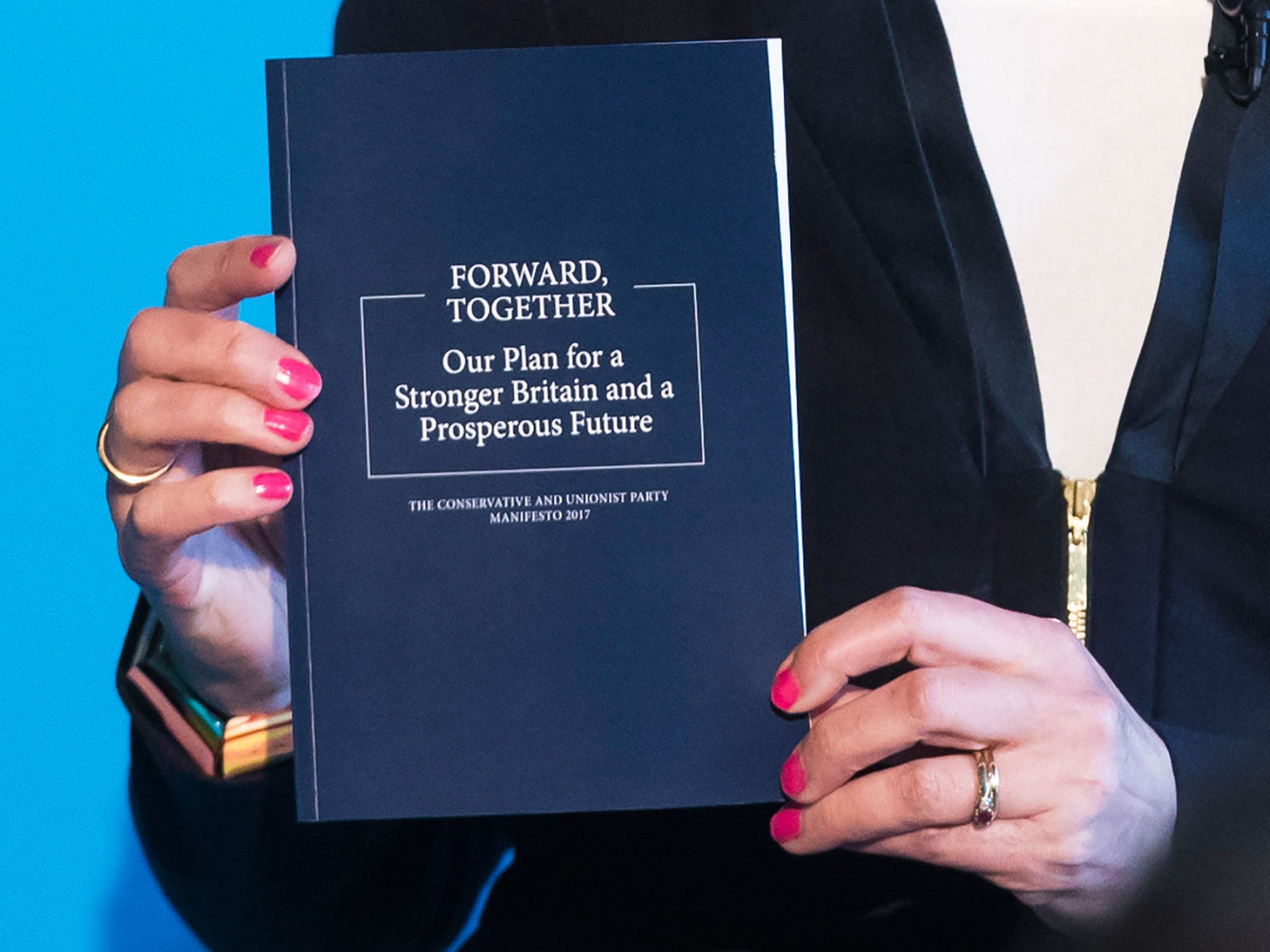 Theresa May holding the Tory manifesto during the launch in Halifax