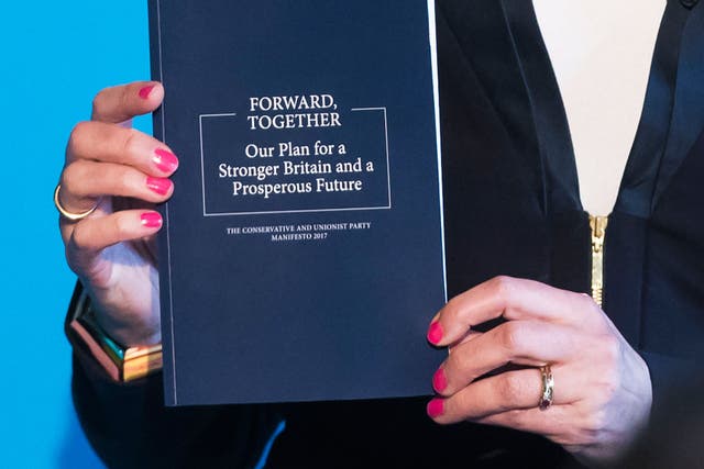 Theresa May holding the Tory manifesto during the launch in Halifax