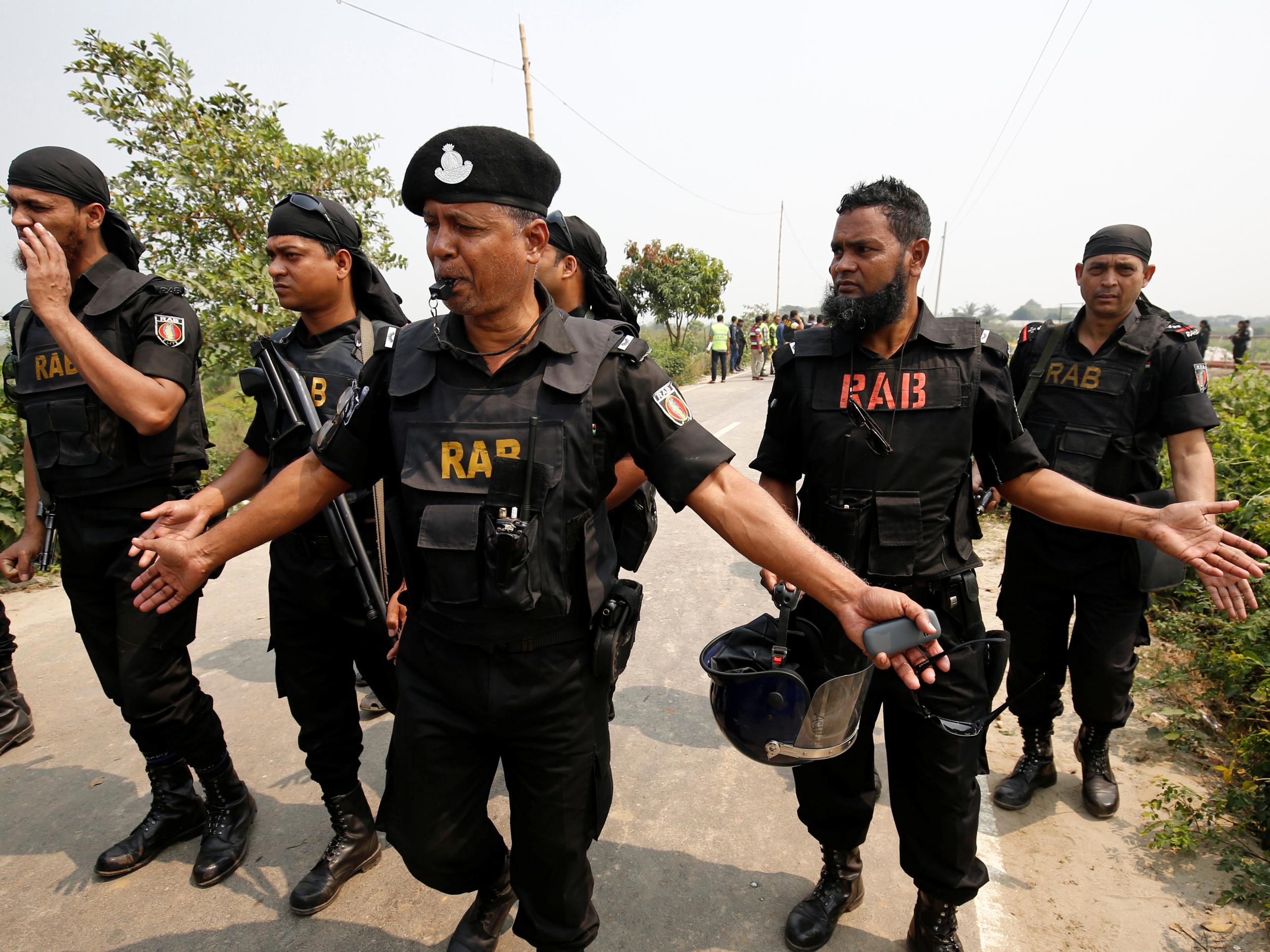 Security personnel from the elite Rapid Action Battalion (RAB), who made the arrests